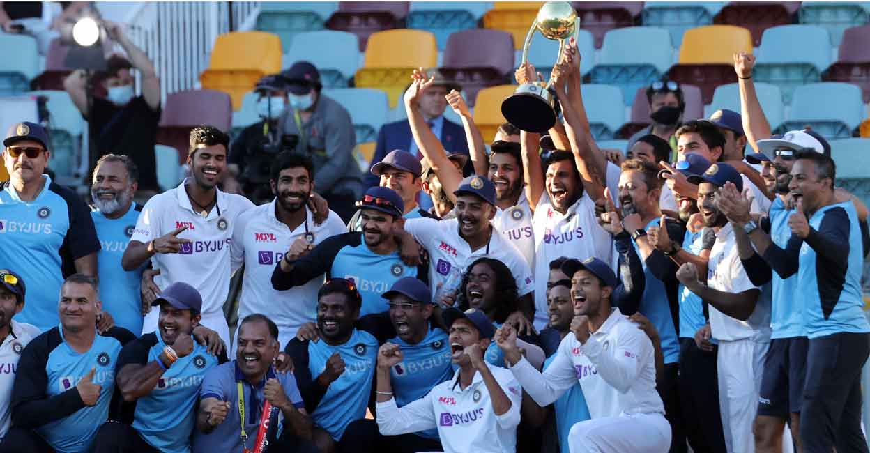 Indian players and support staff celebrate with the Border-Gavaskar Trophy after winning the 2020-21 series Down Under. File photo: AFP/Patrick Hamilton 