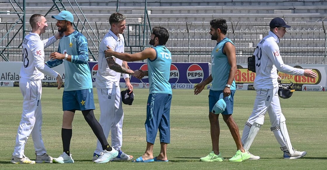 England and Pakistan players greet each other after the Multan Test. File photo: AFP/Aamir Qureshi