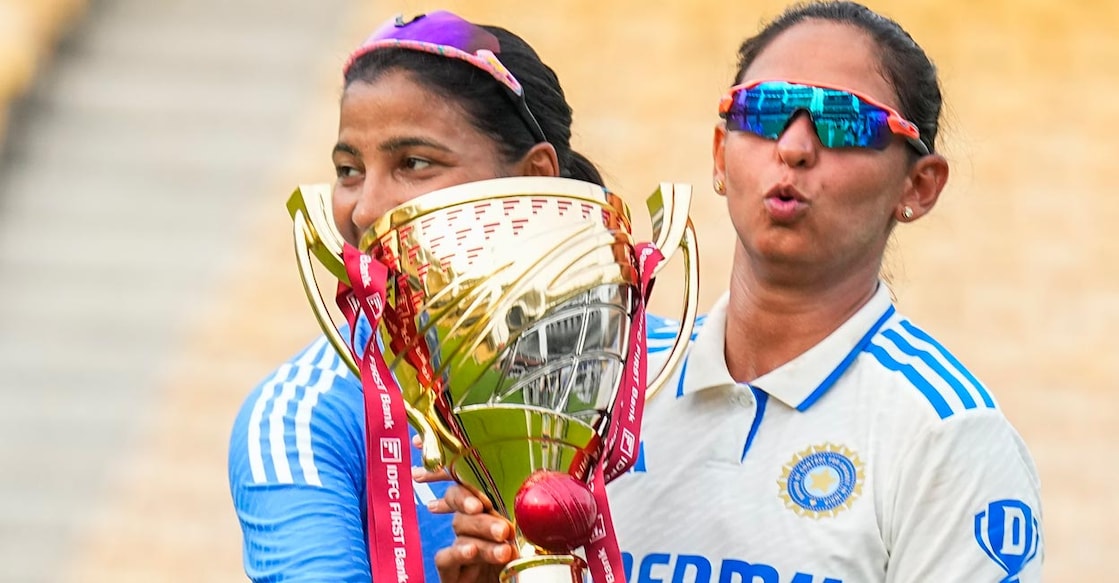 Indian skipper Harmanpreet Kaur, right, poses with the winner's trophy. File photo: PTI/R Senthil Kumar
