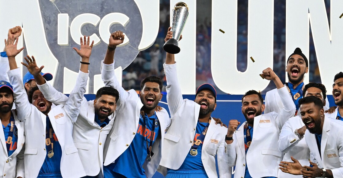 India's players celebrate with the trophy after winning the ICC Champions Trophy in Dubai on March 9, 2025. Photo: AFP/ Ryan Lim