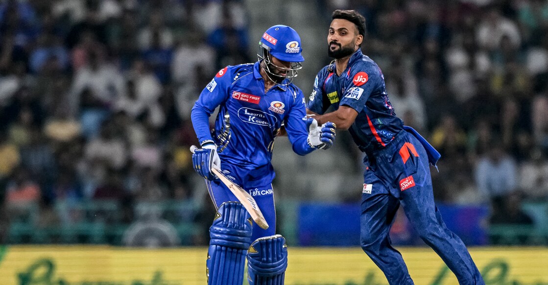 Lucknow Super Giants' Akash Deep (R) tries to field the ball as Mumbai Indians' Tilak Varma runs between the wickets during the IPL. Photo: AFP/Arun Sankar