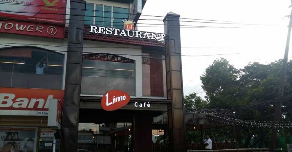 Why do you need to visit 'TJ Restaurant' in Kottayam 
