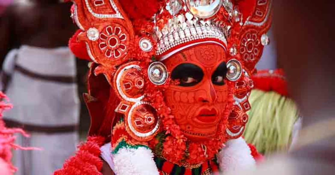 Kannur, India - January 05,2015: Unidentified Theyyam artist performs at Kadannappalli Muchilot Bhagavati temple in Kannur, Kerala, India.Theyyam is a ritualistic traditional art form of Kerala