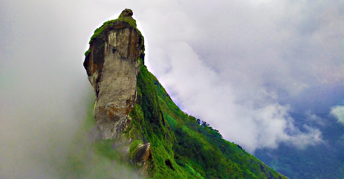 The unique rock formation is a marvel of nature and the sight of Illickal Kallu blanketed by mist is a treat for the eyes. Photo: Shutterstock/Amarjith Paul