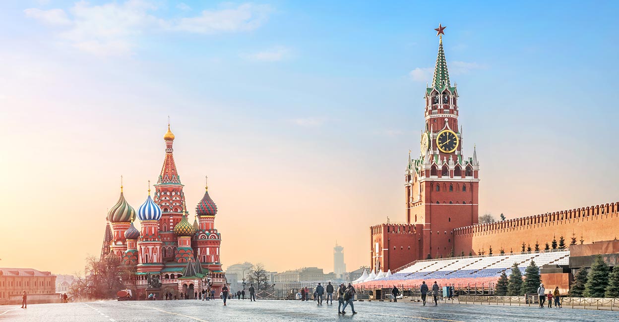 Gentle blue sky morning over St. Basil’s Cathedral and Spasskaya Tower on Red Square in Moscow. Photo: iStock/yulenochekk