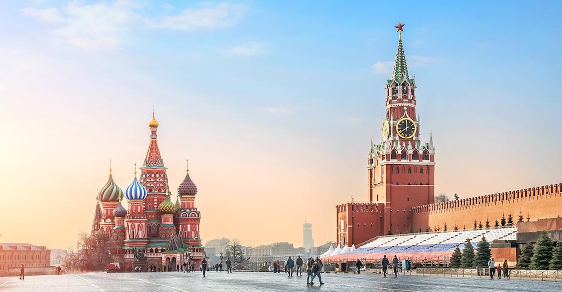 Gentle blue sky morning over St. Basil’s Cathedral and Spasskaya Tower on Red Square in Moscow. Photo: iStock/yulenochekk
