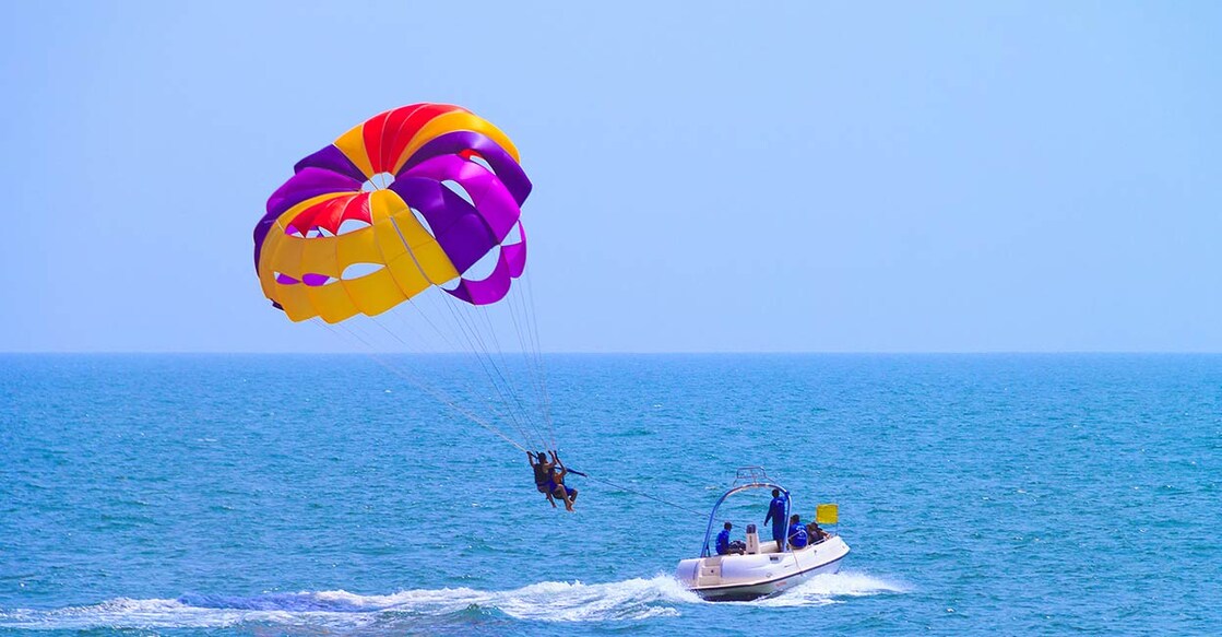 Parasailing at Candolim Beach in Goa. Photo: Shutterstock/Murgermari