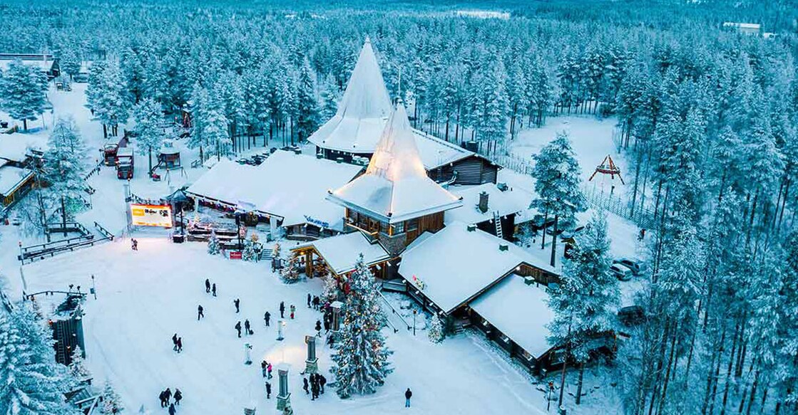 Tourists can explore the Santa Claus village to meet Santa and check out the 'Santa Claus post office' with its special stamps and souvenirs, ice sculptures, Santapark, and more.  Photo: Shutterstock/Marcelo Souza de Araujo