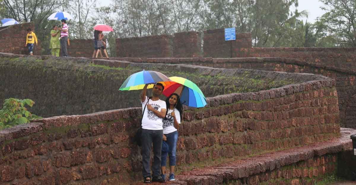 Sinquerim: Tourists visit Fort Aguada during rains in Sinquerim, Goa on July 3, 2018. (Photo: IANS)