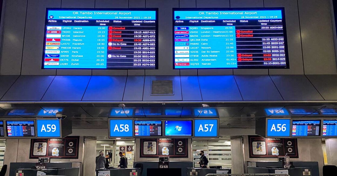 Digital display boards show cancelled flights to London - Heathrow at OR Tambo International Airport in Johannesburg, South Africa, November 26, 2021. File Photo: REUTERS/ Sumaya Hisham