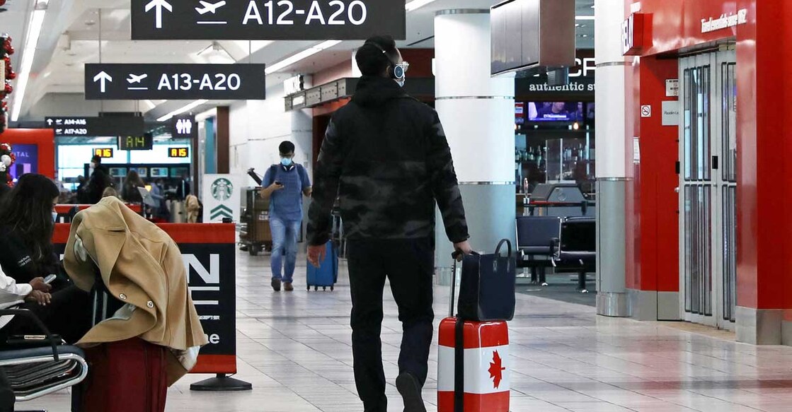 A United States-bound passenger walks in Toronto Pearson Airport's Terminal 3. Photo: Reuters/Chris Helgren/File