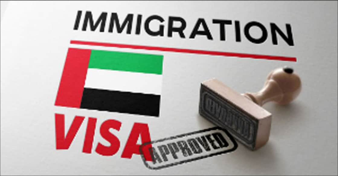 United Arab Emirates Visa Approved with Rubber Stamp and national flag. Photo: Shutterstock