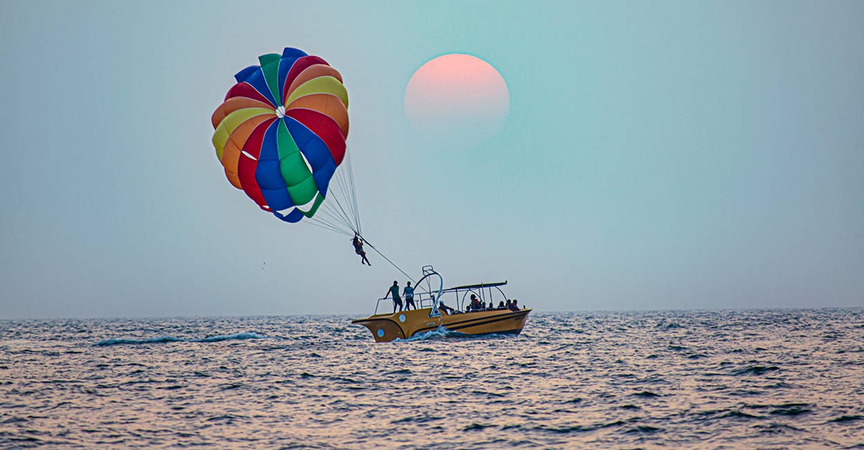 Parasailing at Candolim Beach in Goa. Photo: iStock/Rohit Bhakar 
