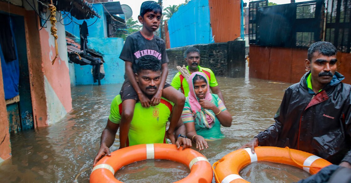 Tamil Nadu Fire and Rescue Services personnel rescue people from a flooded area after heavy rain, in Kanyakumari district on Sunday, Dec. 17, 2023. Photo: PTI