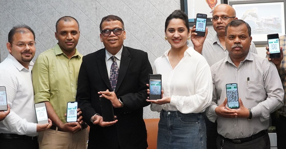 Actor Miya George launches Kochi Metro's WhatsApp ticketing service at the KMRL office in the presence of Managing Director Loknath Behera and officials. Photo: Special arrangement