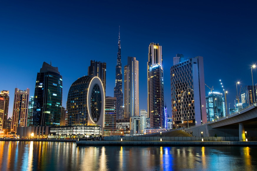 1309800161 Dubai modern architecture landmark skyline view from the Marasi marina in city Business bay downtown area in the United Arab Emirates at blue hour at night