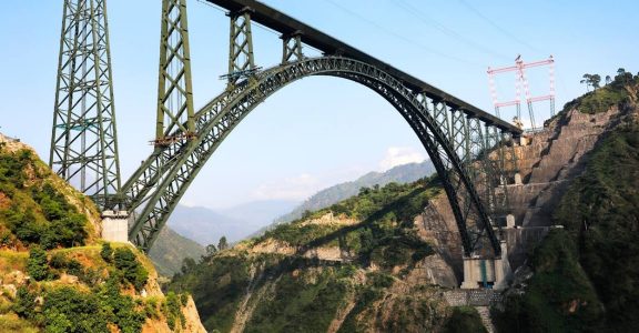 Railways conducts trial run on world's highest arch rail bridge in ...