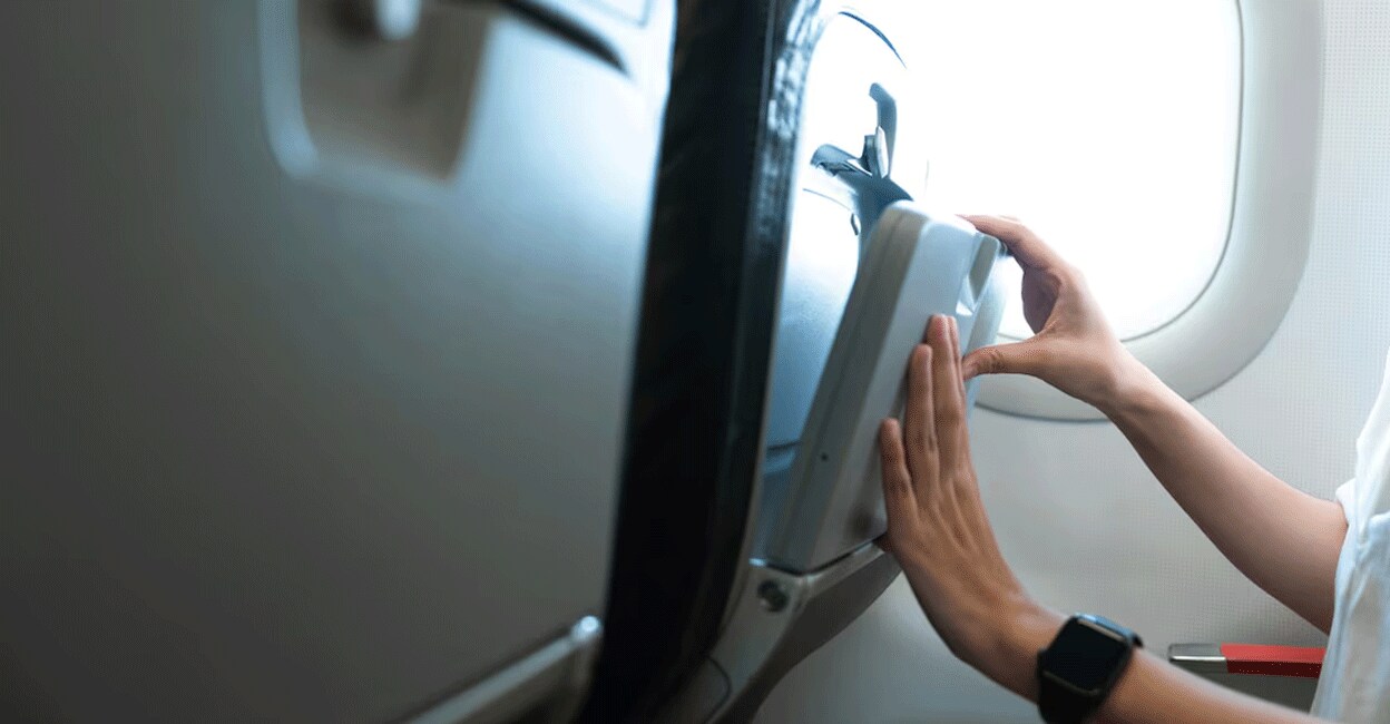 Crew members will ensure that the tray tables are folded and locked when the aircraft takes off and lands. Photo: iStock/ATHVisions