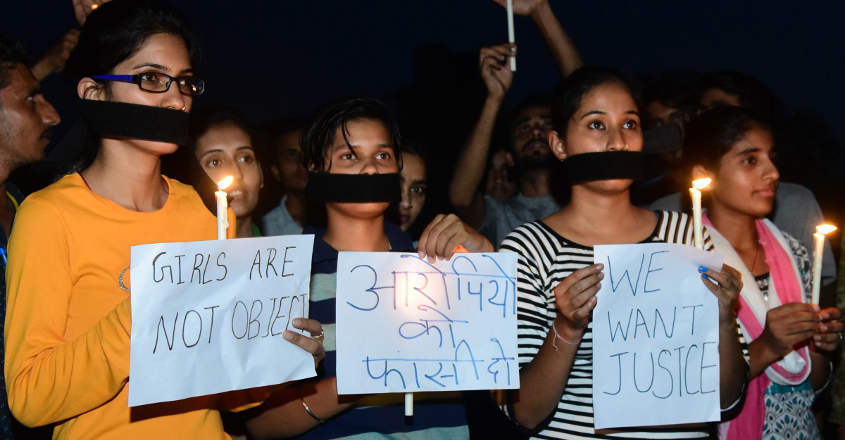 Youth take part in a candle march in protest against the rape of an eight-year-old girl in Mandsaur, at Bikaner on Saturday,June 30,2018. PTI 