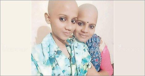 Happy to be bald: Mother, daughter donate hair for cancer patients